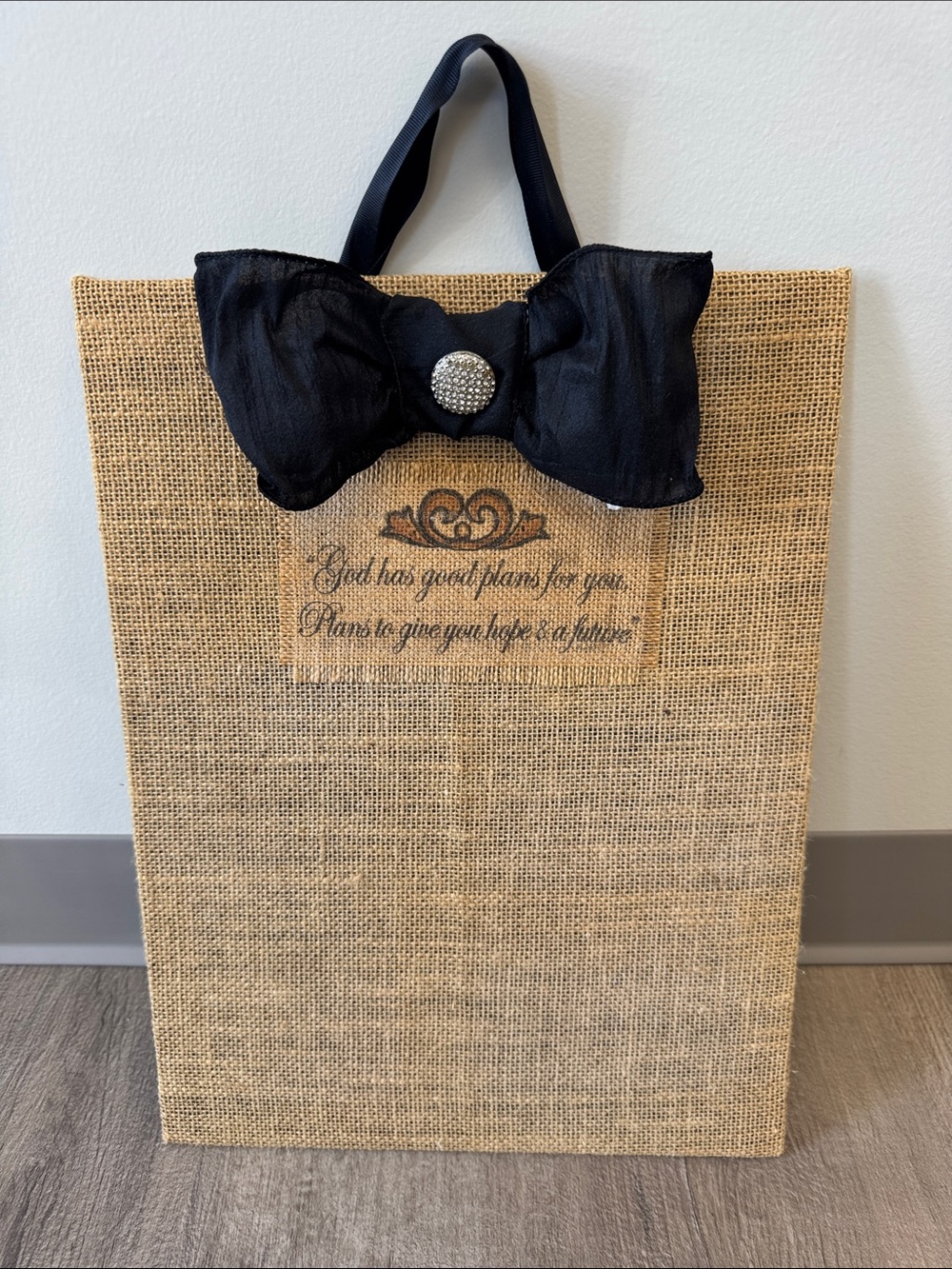 Natural Burlap Tote with Black Bow Accent
12 wide by 17 tall it’s magnetic